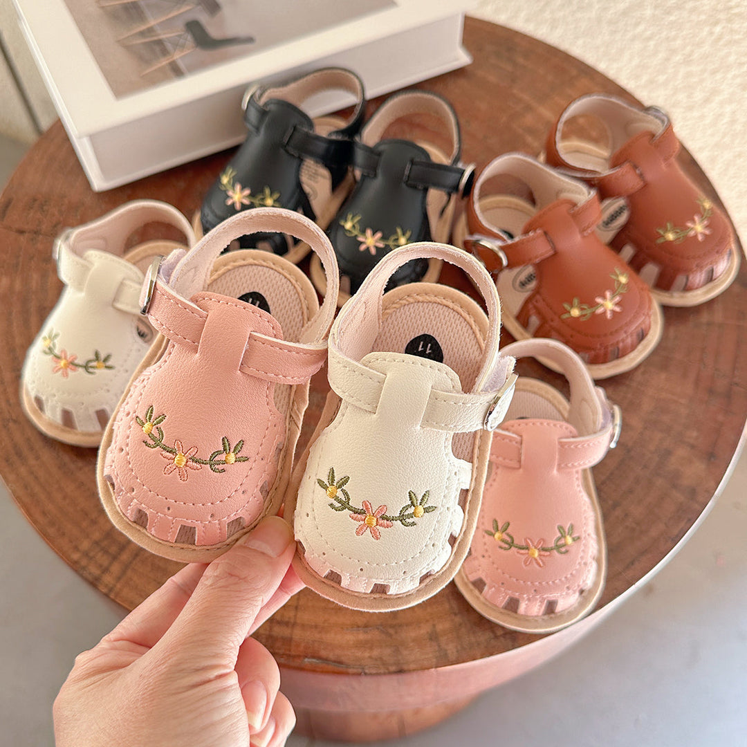 **Title:** Girls' Sandals with Floral Embroidery - Soft Faux Leather and Anti-Slip Sole  

**Handle:** girls-sandals-floral-embroidery  

**Product Description:**  
Step into summer style with these adorable girls' sandals! Featuring beautiful floral embroidery, these sandals are crafted from soft faux leather for ultimate comfort. Plus, the anti-slip sole keeps little feet safe while they explore. Perfect for any sunny outing!  

**Variants:**  
- **Color:** Pink  
- **Size:** 7  
