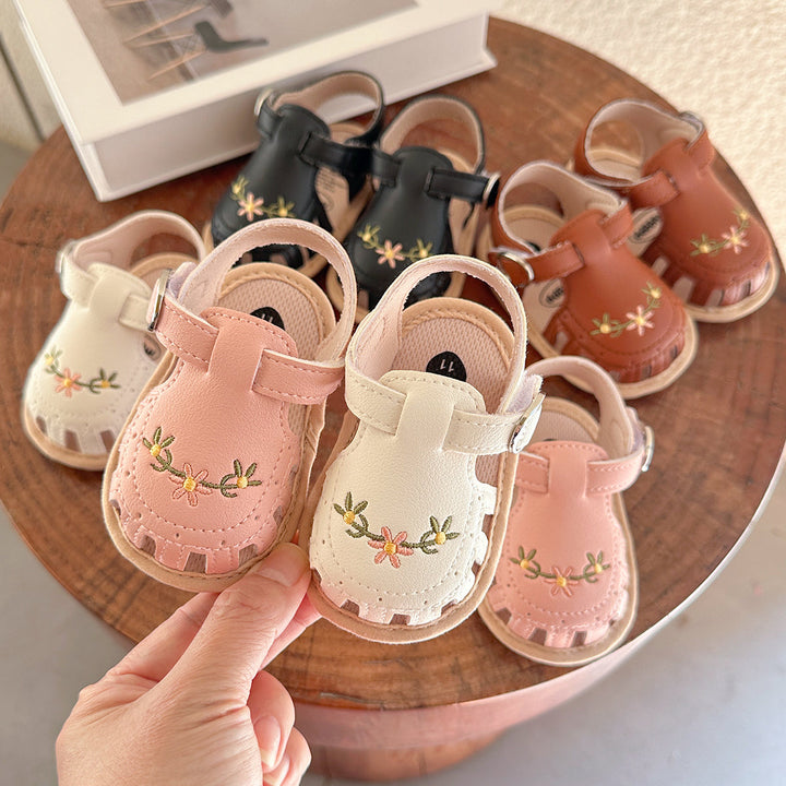 **Title:** Girls' Sandals with Floral Embroidery - Soft Faux Leather and Anti-Slip Sole  

**Handle:** girls-sandals-floral-embroidery  

**Product Description:**  
Step into summer style with these adorable girls' sandals! Featuring beautiful floral embroidery, these sandals are crafted from soft faux leather for ultimate comfort. Plus, the anti-slip sole keeps little feet safe while they explore. Perfect for any sunny outing!  

**Variants:**  
- **Color:** Pink  
- **Size:** 7  