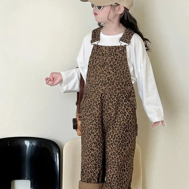 Title: Girls' Adjustable Shoulder Strap Leopard Print Dungarees 

Handle: girls-adjustable-shoulder-strap-leopard-print-dungarees

Product Description: 
Get your little one ready to roar in these adorable girls' dungarees featuring a stylish leopard print! Made from comfy cotton and equipped with adjustable shoulder straps, these overalls combine fashion and function perfectly. They're perfect for playtime in the garden or just hanging out! 

Variants: 
- Size 5
- Color: Leopard Print